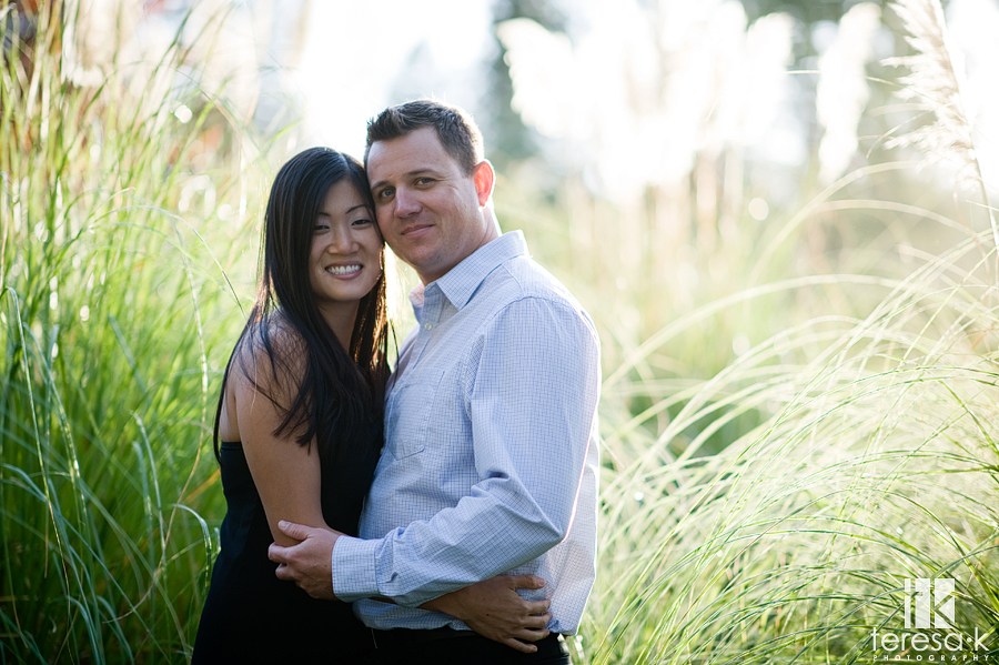 gorgeous backlit image in the foothills of northern California of newly engaged couple