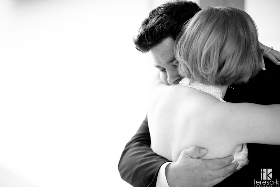 bride and groom in an emotional embrace 