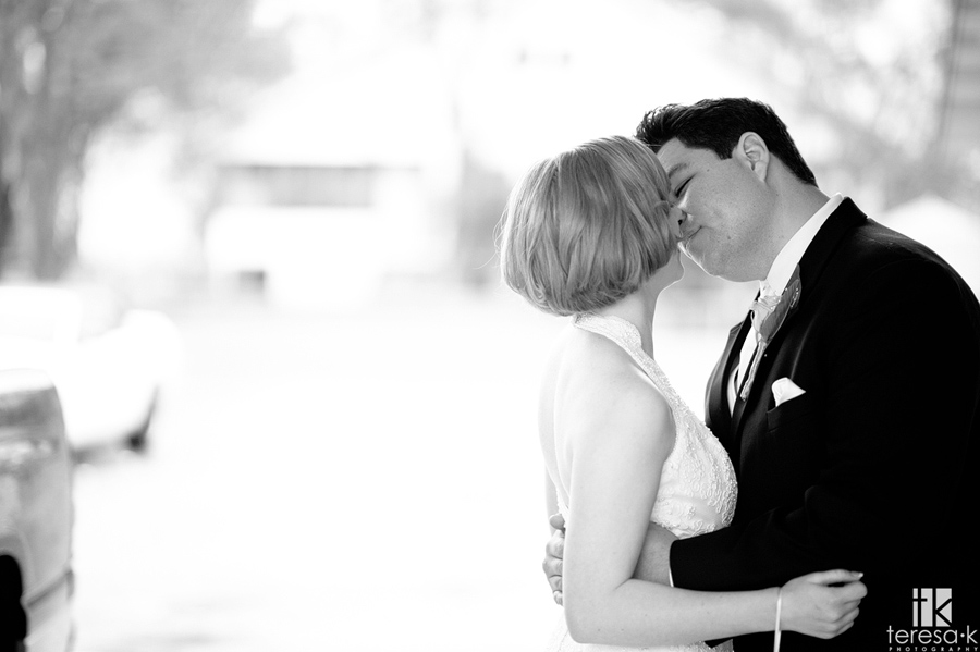 bride and groom sharing a passionate kiss