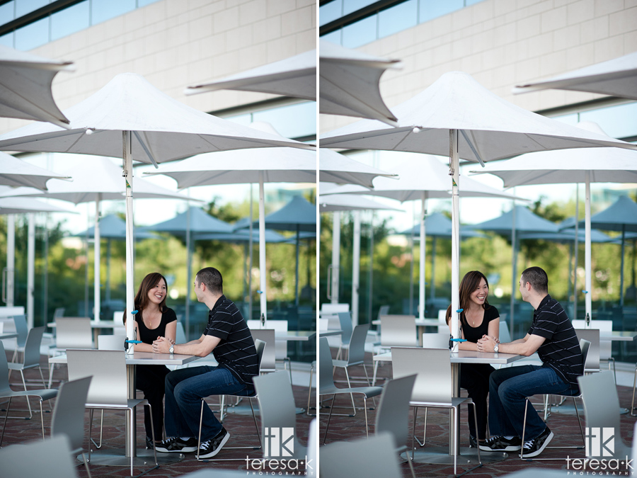 Cute picture of couple interacting under an umbrella at the CalStrs building