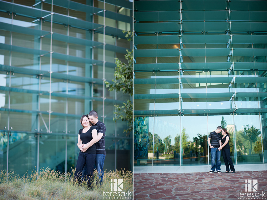 modern engaged couple in front of the CalStrs building