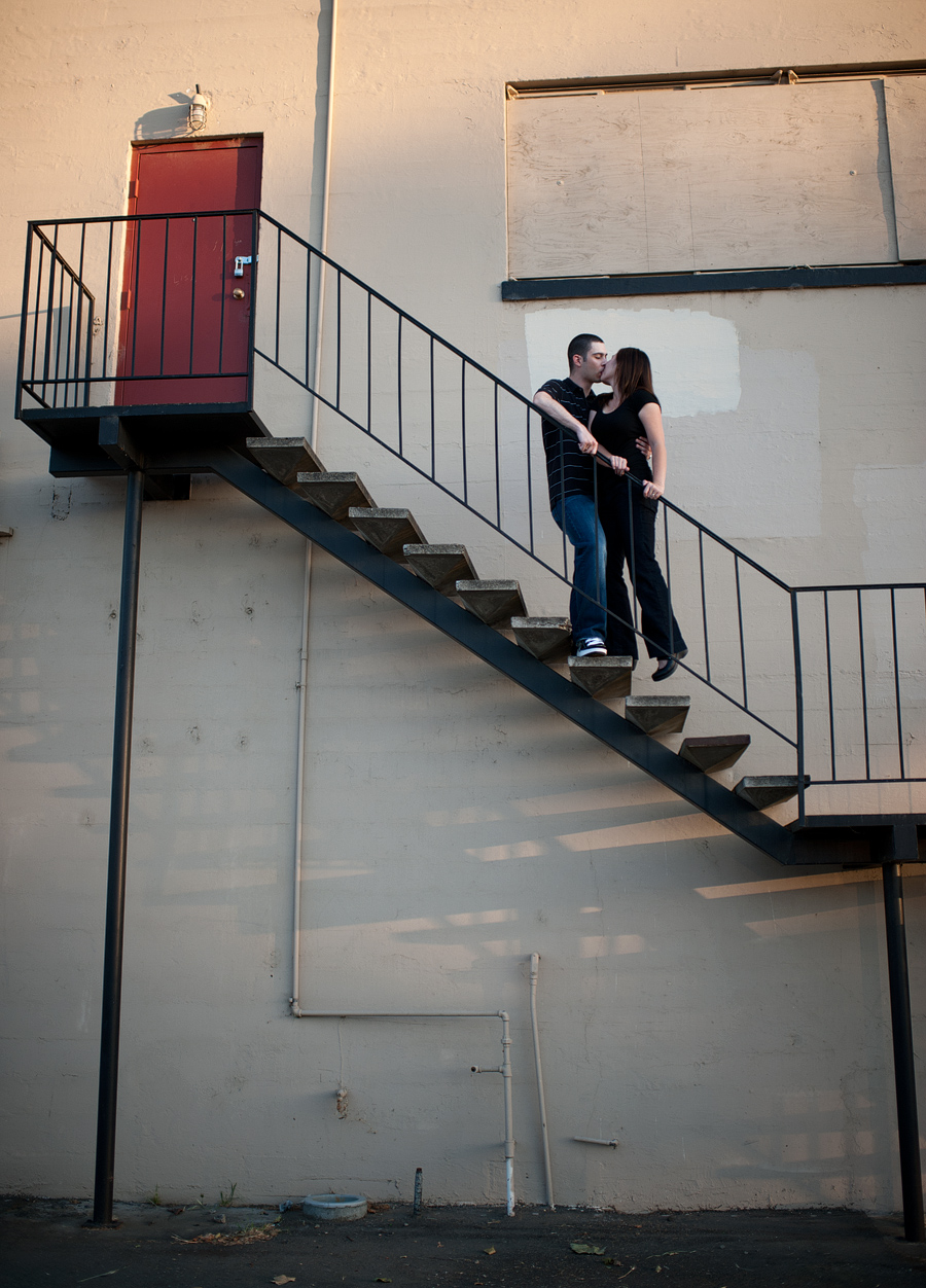 modern urban image of bride and groom on staircase