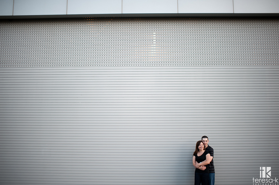 contemporary image of engaged couple at the CalStrs building