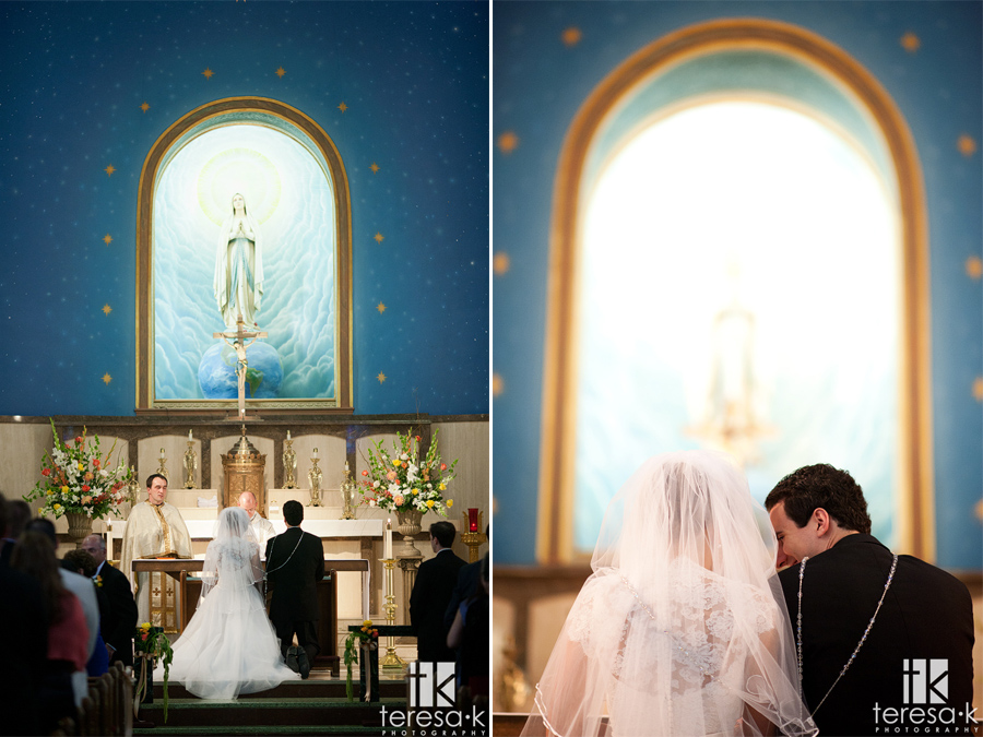 groom sneaks a peek at bride in catholic ceremony