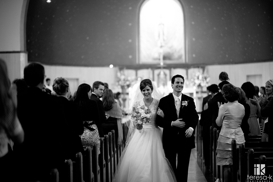 man and wife walk down the aisle at st. Mary’s church