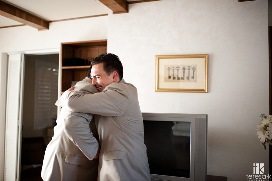Groom hugging his brother after the wedding ceremony