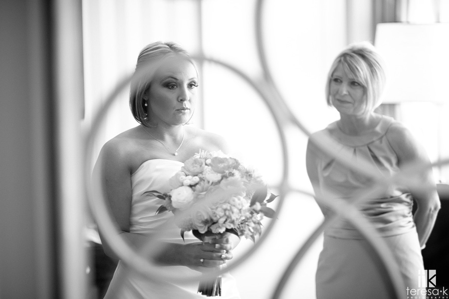 beautiful bride looking in mirror at the citizen hotel