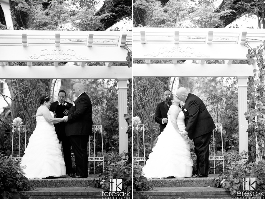 bride and groom kiss at rainy day wedding in Newcastle