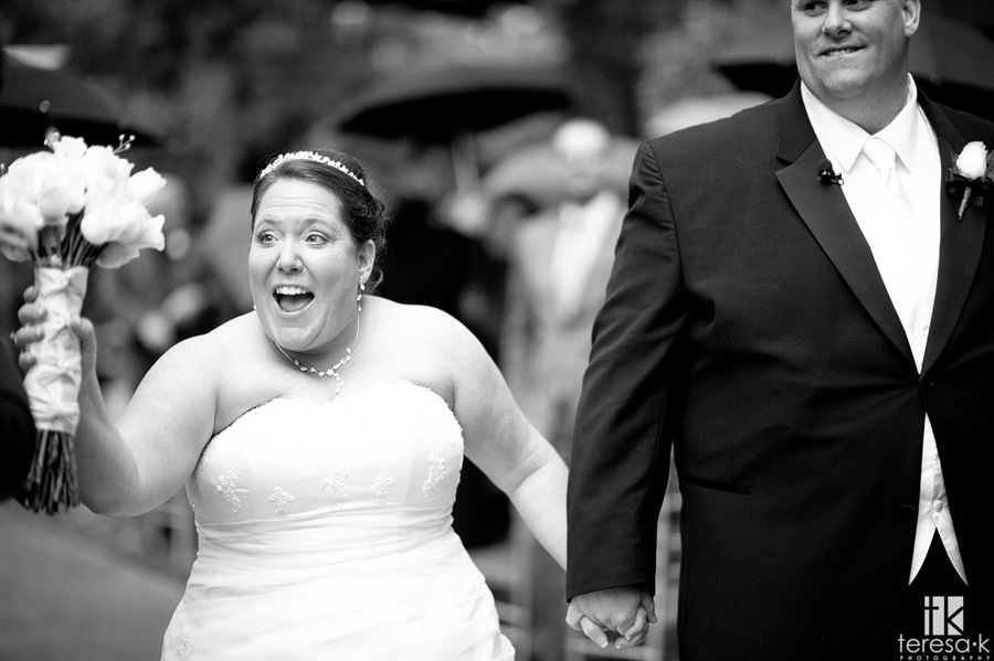 super excited bride after getting married in the rain