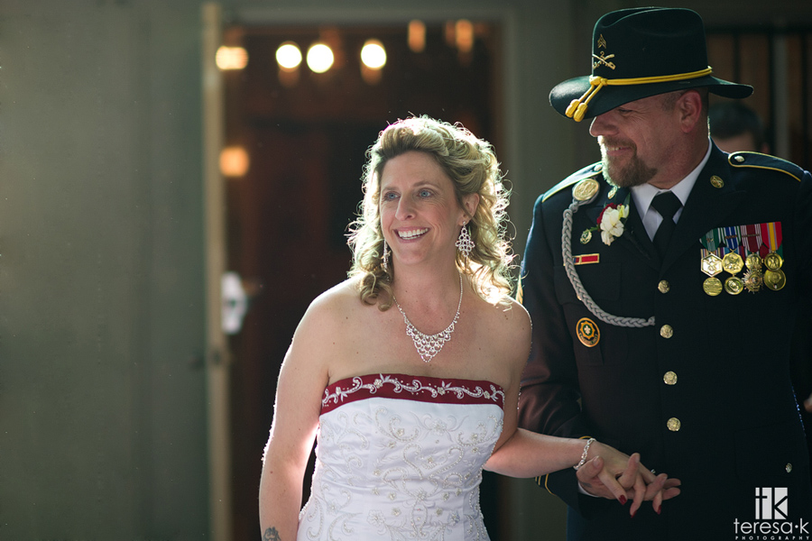 bride and army groom enter reception
