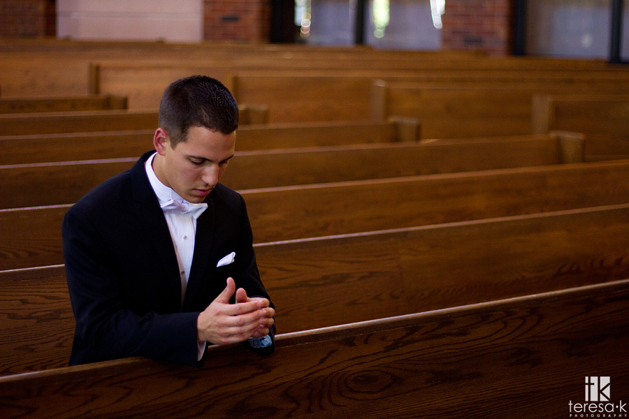 catholic groom prays before wedding