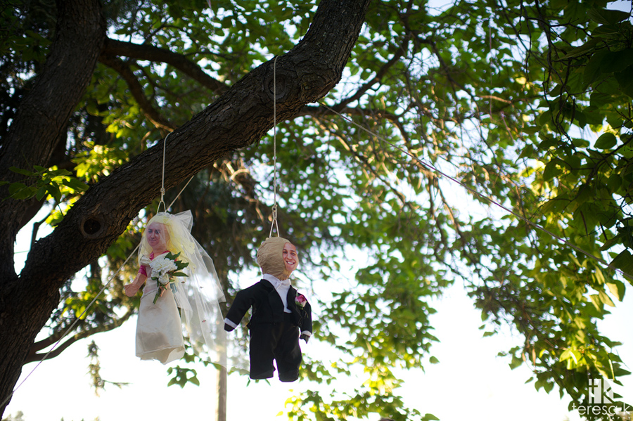 hanging piñatas of bride and groom