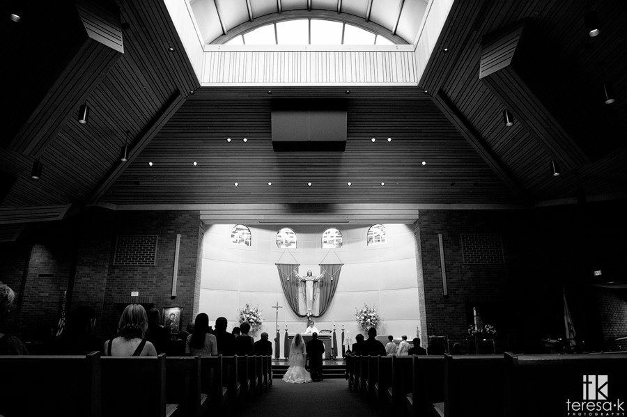 wide shot of wedding at st john the Baptist church in Folsom