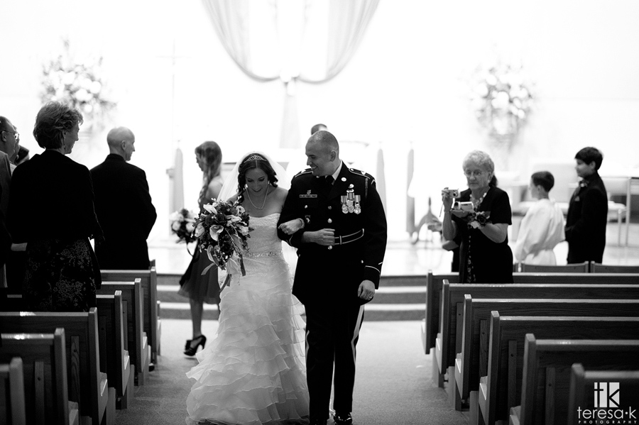bride and groom in Folsom catholic church