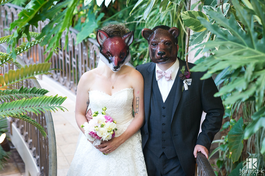 bride and groom in zoo masks
