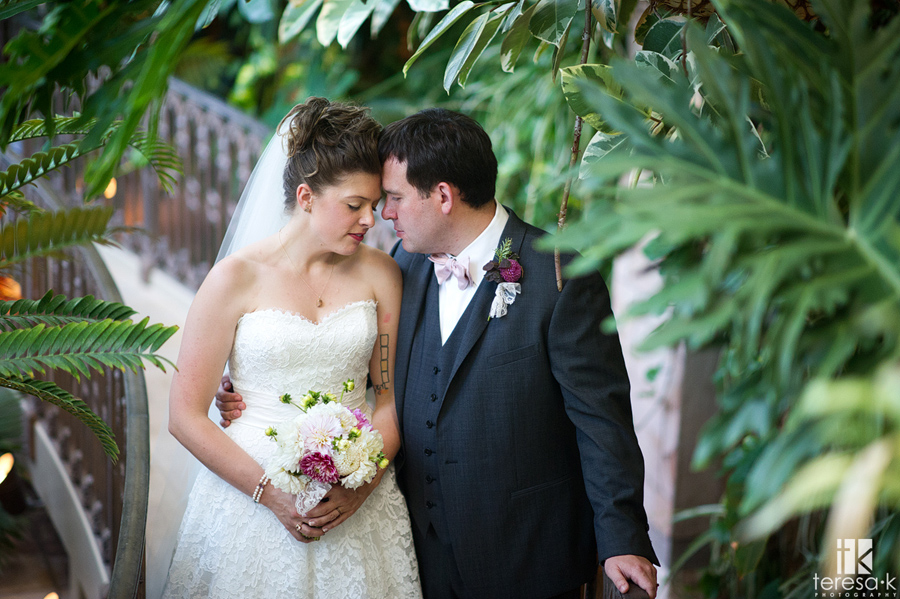 bride and groom in the garden at the Sacramento grand ballroom