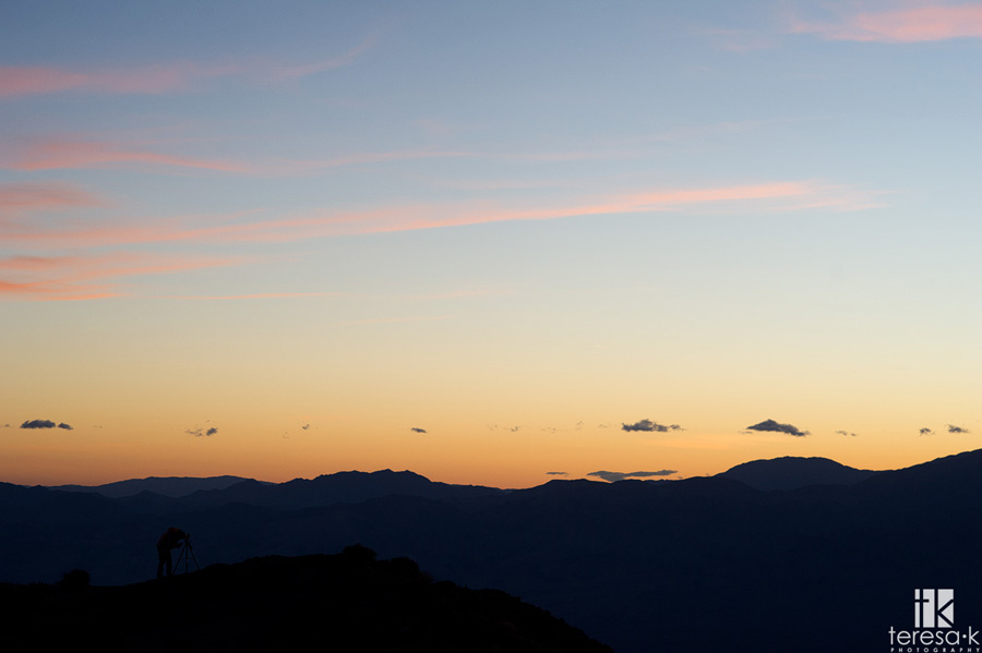 photographer at dantes peak in sunset