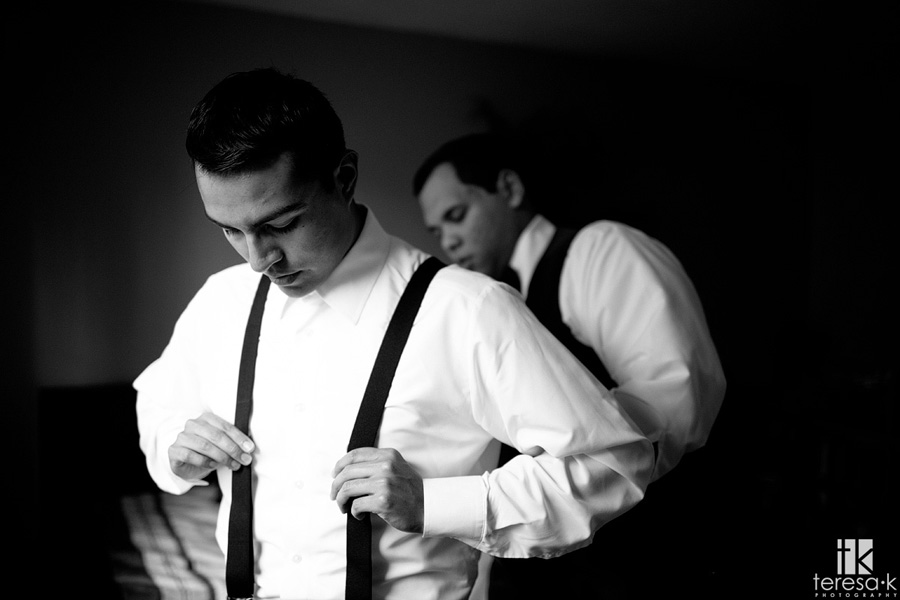 groom straightens suspenders